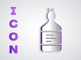 Paper cut Tequila bottle icon isolated on grey background. Mexican alcohol drink. Paper art style. Vector.