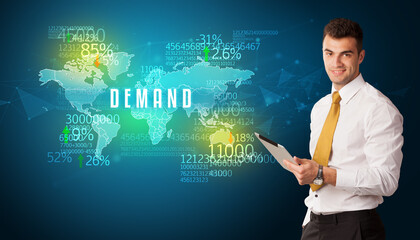 Businessman in front of a decision with DEMAND inscription, business concept