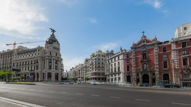 Madrid city center timelapse of traffic near famouse Metropolis building on Gran Via street