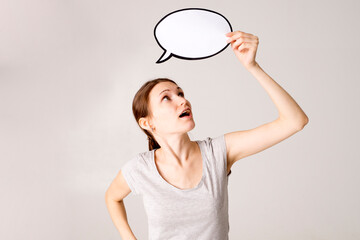 woman holding blank speech bubble