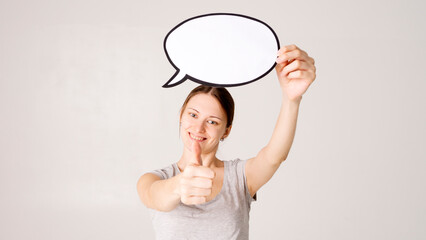 woman holding blank speech bubble