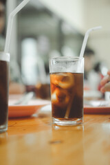 Soft drink in glass with ice on table at Thai local restaurants