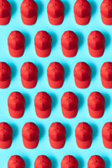 Knolling Red Hats on Blue Background Directly from above