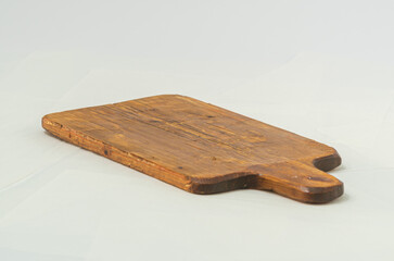 Wooden cutting board on white