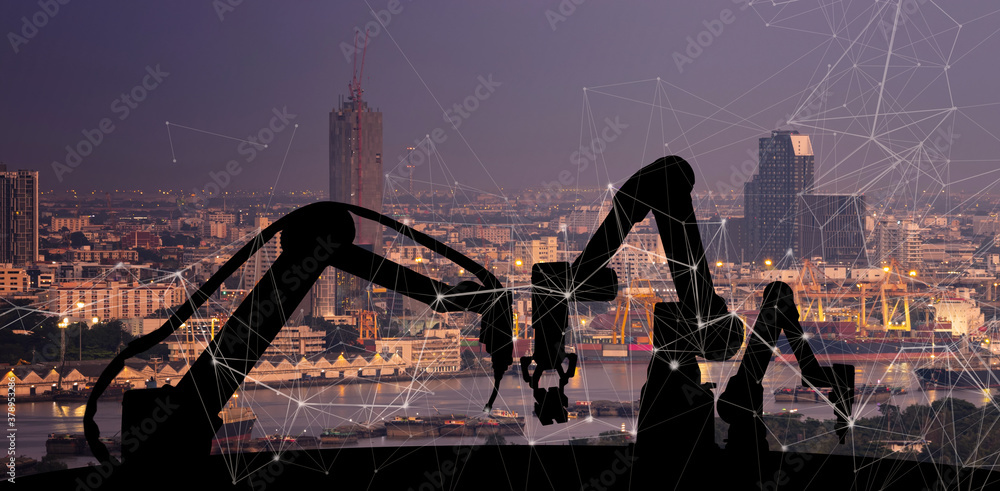 Leinwandbilder Silhouette of modern automation robot arms with Ai assistant technology network concept and metropolis city building background.