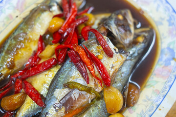 Thai mackerel in dark soy sauce with garlic and red chili pepper