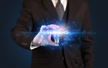 Businessman holding light bulb with SERVERS inscription, innovative technology concept