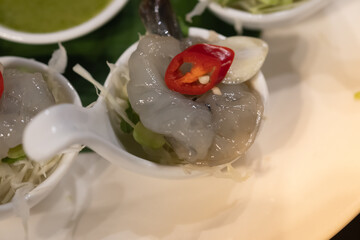 Shrimp on vegetable on top with chili eating with spicy sauce, seafood Thailand. blurred and selective focus