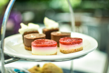 Afternoon tea with dessert and scones served on a beautiful tray