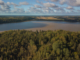 Aerial landscape, countryside, lake, forest and fields. Landscape of Finland, Scandinavia. September drone photo