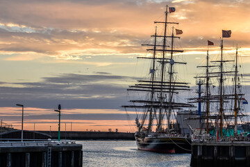 Scheveningen. Beautiful sailing ships in the harbor of Scheveningen, at sunset . Netherlands, Holland, Europe