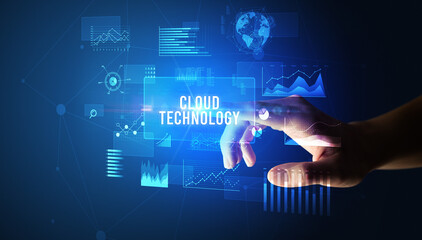 Hand touching CLOUD TECHNOLOGY inscription, new business technology concept