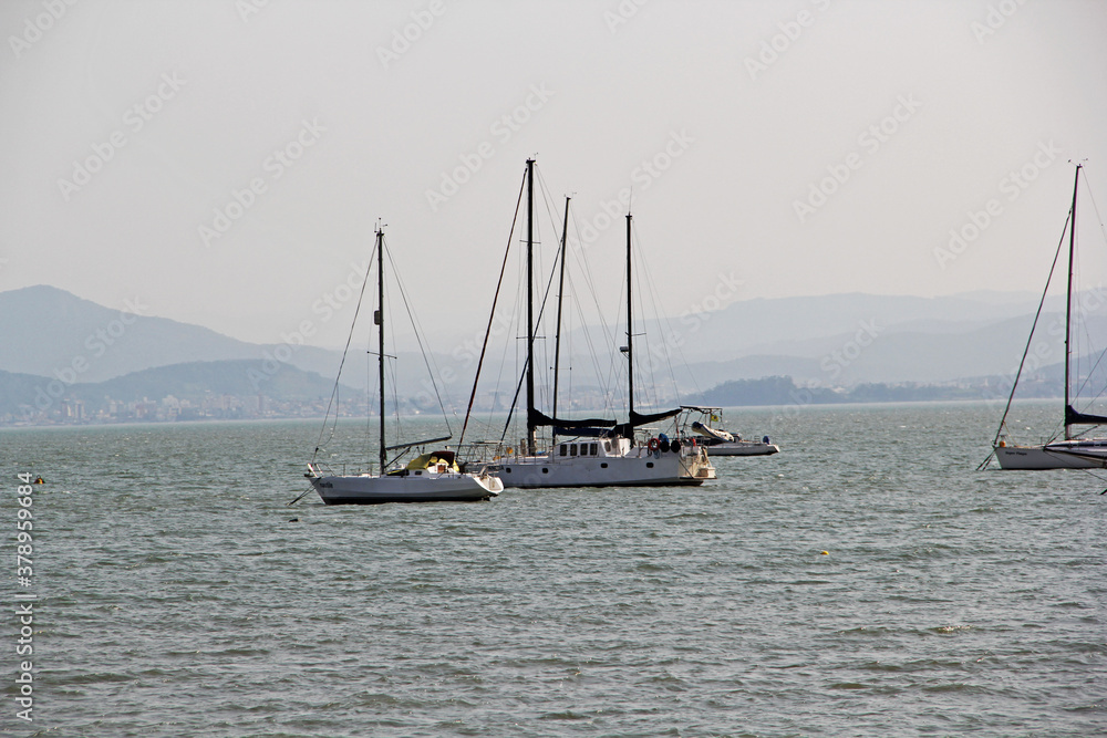 Wall mural Boats in sea water
