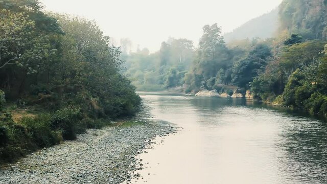 River in the foothills of the Central plateau of Sri Lanka, the winter low water period. Floodplain forest and gallery forest on a Prairie site, evergreen broad-leaved forests.

