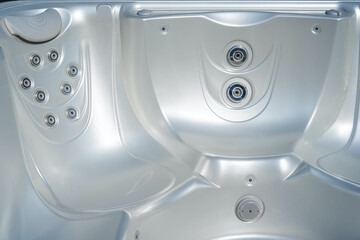 Luxury pearlescent color Jacuzzi. Closeup of bath tubs at spa. Hydromassage. 
