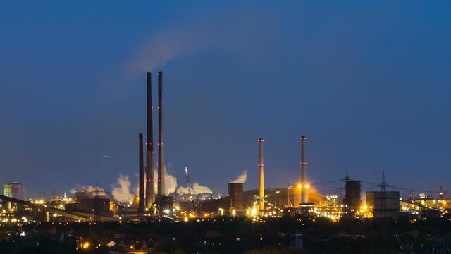 Timelapse sequence of a large coking plant in Duisburg, Germany in the night with coke quenching in between.