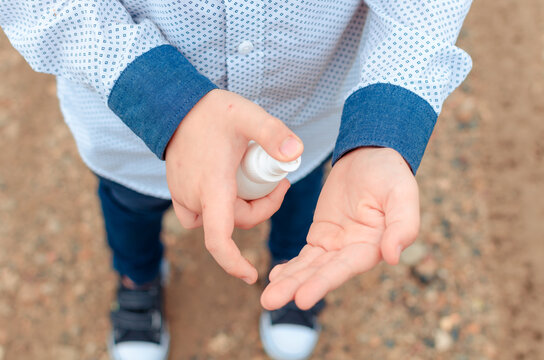 disinfection of the child's hands sanitizer alcohol gel for killing the viruses. back to school. Antiseptic spray. Prevention of coronavirus COVID-19 Cleaning Hands. Education
