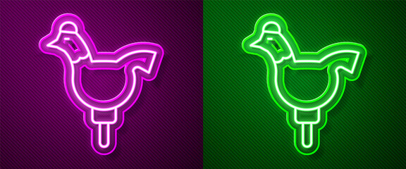 Glowing neon line Candy cockerel lollipop on a stick icon isolated on purple and green background. Vector. © Kostiantyn