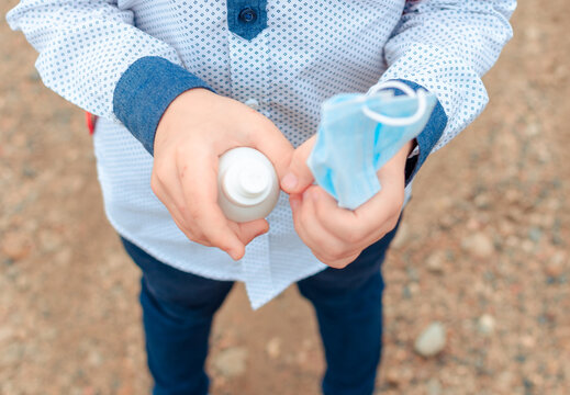 disinfection of the child's hands sanitizer alcohol gel for killing the viruses. back to school. Antiseptic spray. Prevention of coronavirus COVID-19 Cleaning Hands. Education