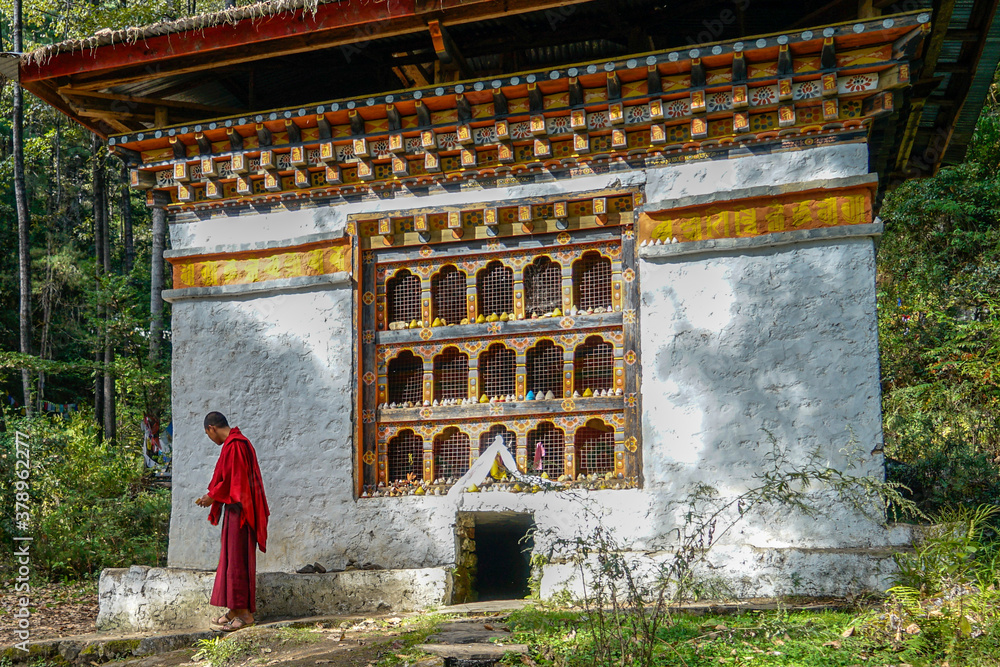 Wall mural bhutan, near the city of paro, a small temple and watermill