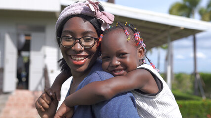 African American Mother And Daughter Relaxing