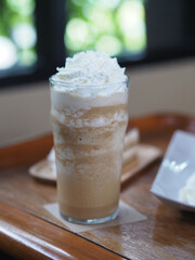 Drink Beverage, iced coffee Cappuccino Smoothie topping with Whipped Cream in glass put on wooden...