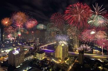 Colorful Fireworks above Bangkok City Cityscape Celebrating , A night long exposure of New Years Eve Celebration.