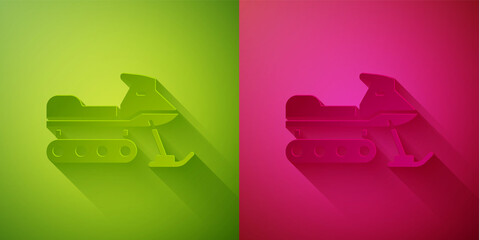 Paper cut Snowmobile icon isolated on green and pink background. Snowmobiling sign. Extreme sport. Paper art style. Vector Illustration.