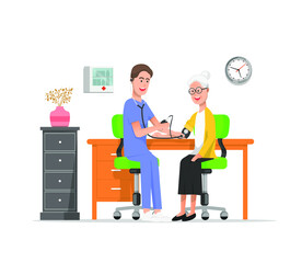 a nurse checks the old woman's blood pressure