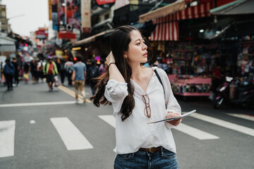 travel lifestyle of happy asian chinese woman. traveler young girl standing on holiday festival...