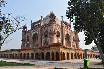 Fototapeta premium A mesmerizing view of safdarjung tomb memorial and dustbin from the side of lawn at winter morning.