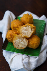 Fried getuk ubi is Malaysian snack food made from tapioca. Fried and served on a banana leaf.