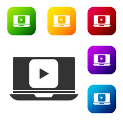 Black Online play video icon isolated on white background. Laptop and film strip with play sign. Set icons in color square buttons. Vector Illustration.