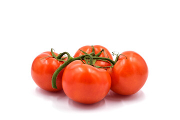 Red tomatoes on the light background.