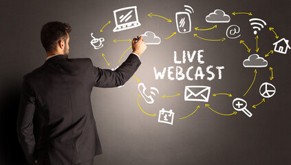 businessman drawing social media icons with LIVE WEBCAST inscription, new media concept