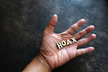 hand and word. Hoax in your hand.