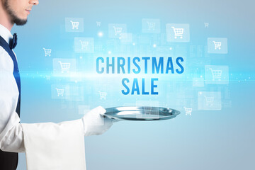 Waiter serving CHRISTMAS SALE inscription, online shopping concept