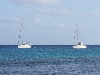Two white yachts on waters of Atlantic Ocean at Sal island, Cape Verde