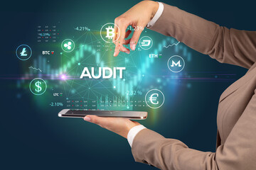 Close-up of a touchscreen with AUDIT inscription, business opportunity concept