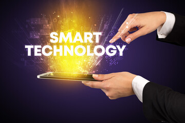 Close-up of a touchscreen with SMART TECHNOLOGY inscription, innovative technology concept