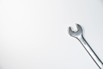 Wrench for car repair on a white background. Top view. Copy space
