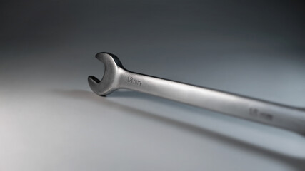 Wrench for car repair. Open-end steel box wrench in the studio
