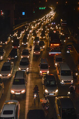 A view of traffic jam at night from the rooftop of bridge.
