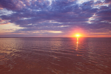 Colorful cloudy sky at sunset. Sunset over the sea. Gradient color. Sky texture. Abstract nature background