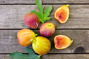 Pink fresh figs on the old wooden table.
