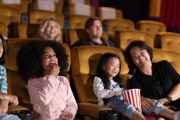 Happy family watching movie in cinema theatre. Happy family time in holiday