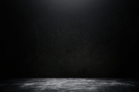 Abstract image of Studio dark room concrete floor texture background with lighting effect.