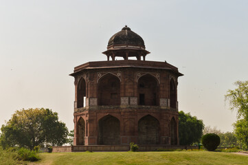 A mesmerizing view of architecture of small tomb at old fort from side lawn.