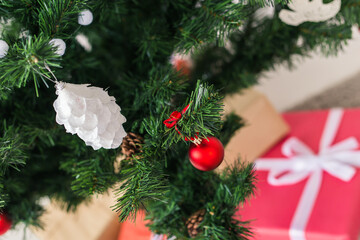 Christmas tree decorations on a christmas fir-tree, close-up. Holidays and decoration concept.