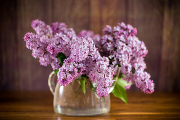 bouquet of beautiful spring flowers of lilac on the table